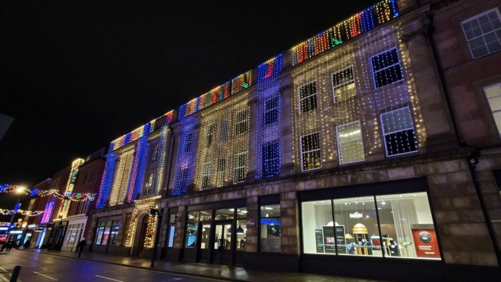 Commercial building with bright Christmas lights in Swansea.