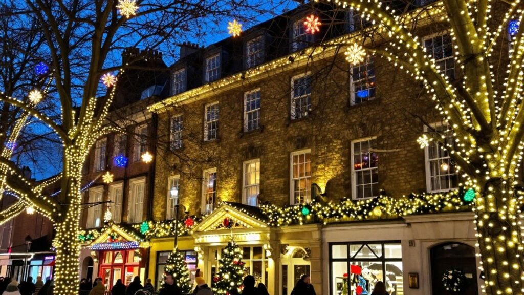 Commercial Christmas lights decorating a building in Swansea.